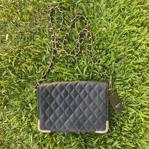 Black flap bag with gold accents